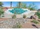 Decorative community sign in an attractive landscaped entry area at 701 Wheat Ridge Ln # 203, Las Vegas, NV 89145