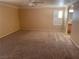 Spacious carpeted bedroom with a large window and natural light at 7020 King Solomons Ct, Las Vegas, NV 89117