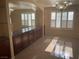 Elegant dining room boasting a stylish light fixture and neutral color palette at 7020 King Solomons Ct, Las Vegas, NV 89117