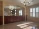 Elegant dining room boasting a stylish light fixture and neutral color palette at 7020 King Solomons Ct, Las Vegas, NV 89117