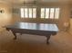 Carpeted game room features a large pool table and natural light at 7020 King Solomons Ct, Las Vegas, NV 89117