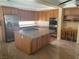 Spacious kitchen featuring a large island, stainless steel appliances, and ample cabinet space at 7020 King Solomons Ct, Las Vegas, NV 89117