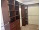 Spacious walk-in closet with custom built-in shelving and drawers, perfect for organization and storage at 7020 King Solomons Ct, Las Vegas, NV 89117