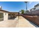 Spacious backyard featuring a covered patio and block wall at 706 Greenway Rd, Henderson, NV 89002