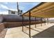 Backyard featuring a covered patio and retaining wall at 706 Greenway Rd, Henderson, NV 89002