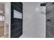 Modern shower stall featuring black and white tile and built-in niche at 706 Greenway Rd, Henderson, NV 89002