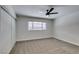 Bedroom featuring carpet, window, closet with sliding doors, and neutral paint at 706 Greenway Rd, Henderson, NV 89002