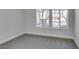 Bright bedroom with neutral walls and carpet and a large window at 706 Greenway Rd, Henderson, NV 89002