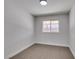 A bedroom with neutral walls and carpet with a window at 706 Greenway Rd, Henderson, NV 89002