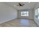 Bright and spacious bedroom with hardwood floors, recessed lighting, and a large window at 706 Greenway Rd, Henderson, NV 89002