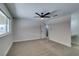 Spacious bedroom with a ceiling fan, window, and door to the bathroom at 706 Greenway Rd, Henderson, NV 89002