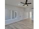 Open-concept living area with wood floors, high ceilings, and plenty of natural light at 706 Greenway Rd, Henderson, NV 89002