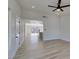 Open-concept living area with wood floors, high ceilings, and plenty of natural light at 706 Greenway Rd, Henderson, NV 89002