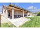 Inviting backyard with covered patio, dining set, and a well-maintained lawn at 7228 Fern Meadow St, Las Vegas, NV 89149