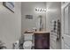 Cozy bathroom with a decorative vanity, ornate mirror, and cute accent decor at 7228 Fern Meadow St, Las Vegas, NV 89149