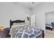 Bedroom featuring a dark wood bed frame, neutral wall paint, and a mirrored closet door at 7228 Fern Meadow St, Las Vegas, NV 89149