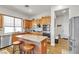 Modern kitchen with stainless steel appliances, granite countertops, and a breakfast bar at 7228 Fern Meadow St, Las Vegas, NV 89149