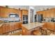 Well-equipped kitchen with stainless steel appliances, granite countertops, and a center island at 7228 Fern Meadow St, Las Vegas, NV 89149