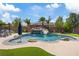 Inviting backyard featuring a pool with rock waterfall, slide, and outdoor seating at 7289 Sea Anchor Ct, Las Vegas, NV 89131