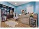 Comfortable bedroom with closet build ins, a play space, and hardwood floors at 7289 Sea Anchor Ct, Las Vegas, NV 89131