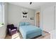 Cozy bedroom with a comfortable bed, a chair, and ample natural light at 7289 Sea Anchor Ct, Las Vegas, NV 89131