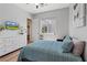 Bright bedroom with a comfortable bed, large dresser, and a wall-mounted TV at 7289 Sea Anchor Ct, Las Vegas, NV 89131