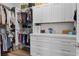 Custom walk-in closet with built-in organizers, drawers, and shelves for efficient storage and access at 7289 Sea Anchor Ct, Las Vegas, NV 89131