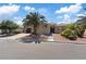 Charming single-story home featuring desert landscaping, a tile roof, and a private gated entrance at 7289 Sea Anchor Ct, Las Vegas, NV 89131