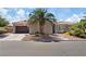 Charming single-story home with desert landscaping, a tile roof, and a two-car garage at 7289 Sea Anchor Ct, Las Vegas, NV 89131