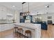 Gourmet kitchen featuring a center island with a modern waterfall countertop and stainless steel appliances at 7289 Sea Anchor Ct, Las Vegas, NV 89131
