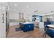 Kitchen featuring a navy island, stainless steel appliances, herringbone backsplash, and bar stool seating at 7289 Sea Anchor Ct, Las Vegas, NV 89131