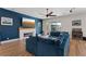 Comfortable living room boasts modern fireplace, recessed lights, outside access, and a custom blue accent wall at 7289 Sea Anchor Ct, Las Vegas, NV 89131