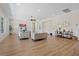 Spacious living room with hardwood floors, modern decor, and lots of natural light at 7289 Sea Anchor Ct, Las Vegas, NV 89131