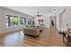 Bright and airy living room with large windows offering a view of the pool and backyard at 7289 Sea Anchor Ct, Las Vegas, NV 89131