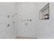 The shower features a tiled wall with hexagon tiles, dual shower heads, and a small shampoo nook at 7289 Sea Anchor Ct, Las Vegas, NV 89131