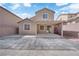 Home's backyard featuring a covered patio, and brickwork along the back wall at 7300 Lavender Rose Ave, Las Vegas, NV 89117