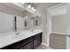 This bathroom features a double sink vanity and modern fixtures at 7300 Lavender Rose Ave, Las Vegas, NV 89117