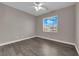 Sunlit, empty bedroom featuring new flooring at 7300 Lavender Rose Ave, Las Vegas, NV 89117
