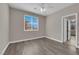Bedroom with wood floors, a ceiling fan, and a window with blinds at 7300 Lavender Rose Ave, Las Vegas, NV 89117