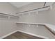 Walk-in closet with wood floor and white shelving at 7300 Lavender Rose Ave, Las Vegas, NV 89117