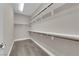 Walk-in closet with built-in shelves and ample storage space at 7300 Lavender Rose Ave, Las Vegas, NV 89117