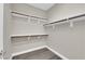 Spacious closet featuring built-in shelving and wood-look flooring at 7300 Lavender Rose Ave, Las Vegas, NV 89117