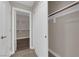 Bright walk-in closet with custom white shelving and rod system at 7300 Lavender Rose Ave, Las Vegas, NV 89117