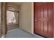 Welcoming front entrance with a gated courtyard and reddish-brown door at 7300 Lavender Rose Ave, Las Vegas, NV 89117