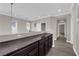 Hallway with cabinets, wood floors, recessed lighting, and natural light at 7300 Lavender Rose Ave, Las Vegas, NV 89117
