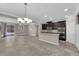 Bright, open-concept kitchen and dining area featuring modern appliances and tile flooring throughout at 7300 Lavender Rose Ave, Las Vegas, NV 89117