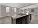 Spacious kitchen features a center island with granite countertops and stainless steel dishwasher at 7300 Lavender Rose Ave, Las Vegas, NV 89117
