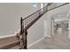 Elegant staircase features dark wood banister and a spacious landing at 7300 Lavender Rose Ave, Las Vegas, NV 89117
