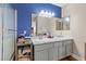 Bathroom features granite countertops, dual sinks, and a framed mirror with modern vanity lighting at 779 Peregrine Falcon St, Henderson, NV 89015