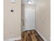 Inviting entryway with wood-look flooring and a classic white front door at 779 Peregrine Falcon St, Henderson, NV 89015